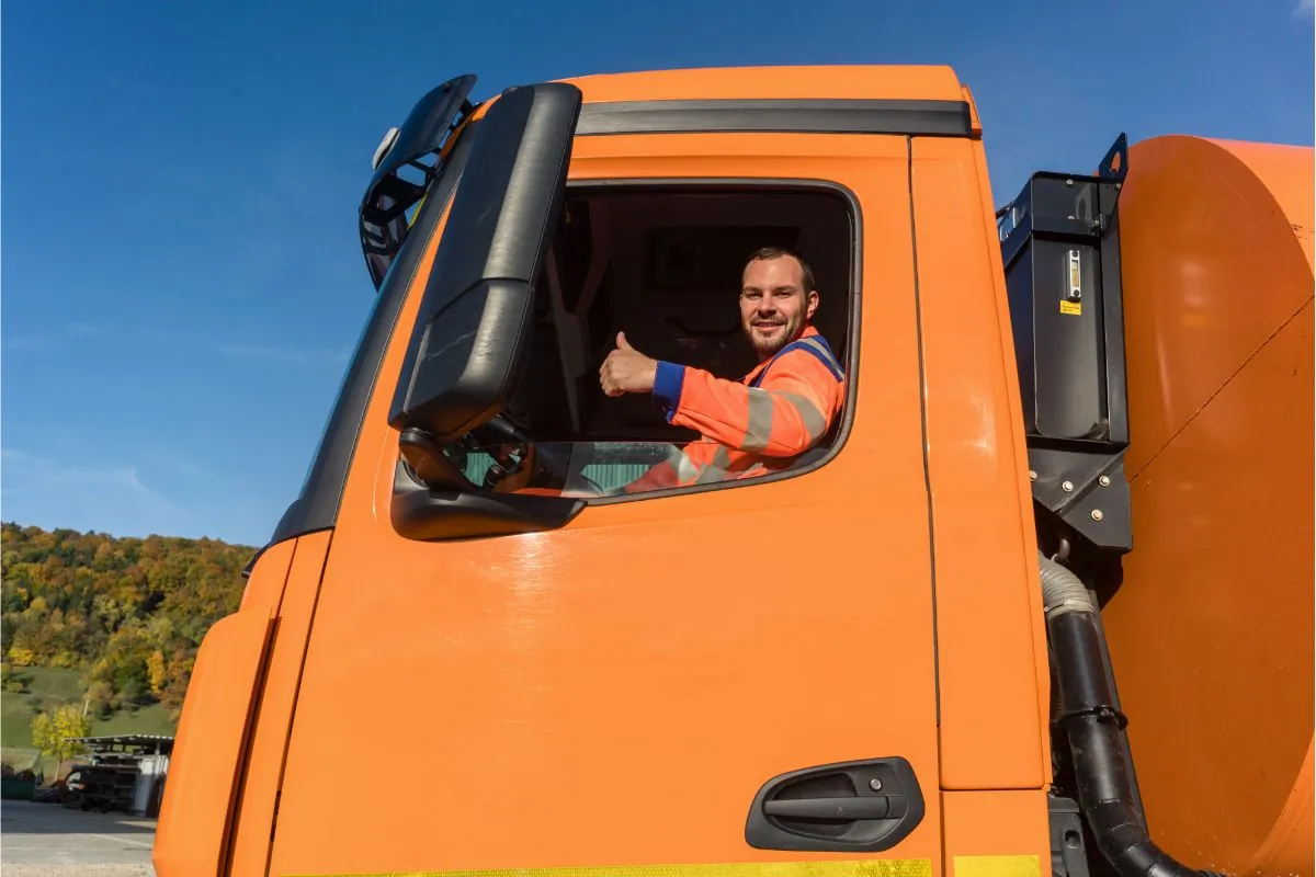 dumpster truck driver thumbs up sign