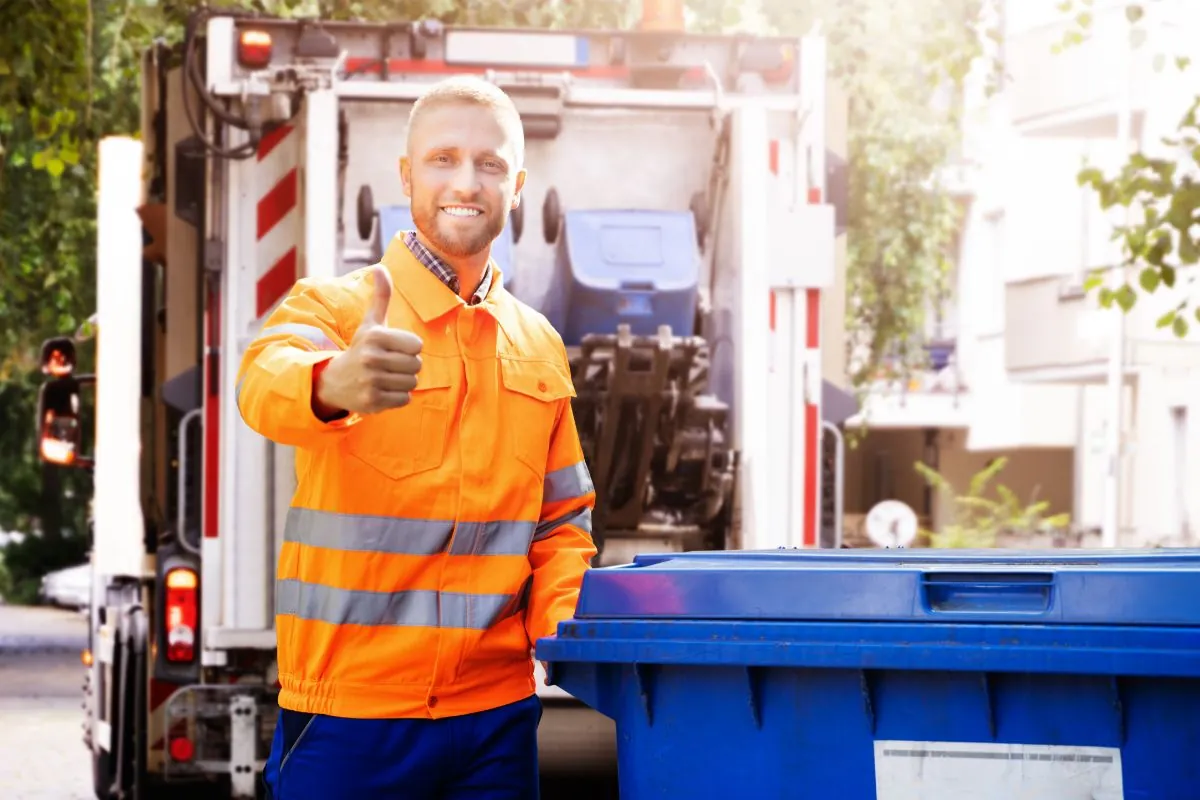 garbage collector smiling while working